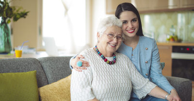 image of an elderly resident and a carer.